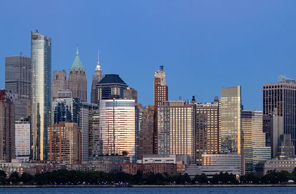 large-skyscrapers-downtown-new-york-sunset.webp